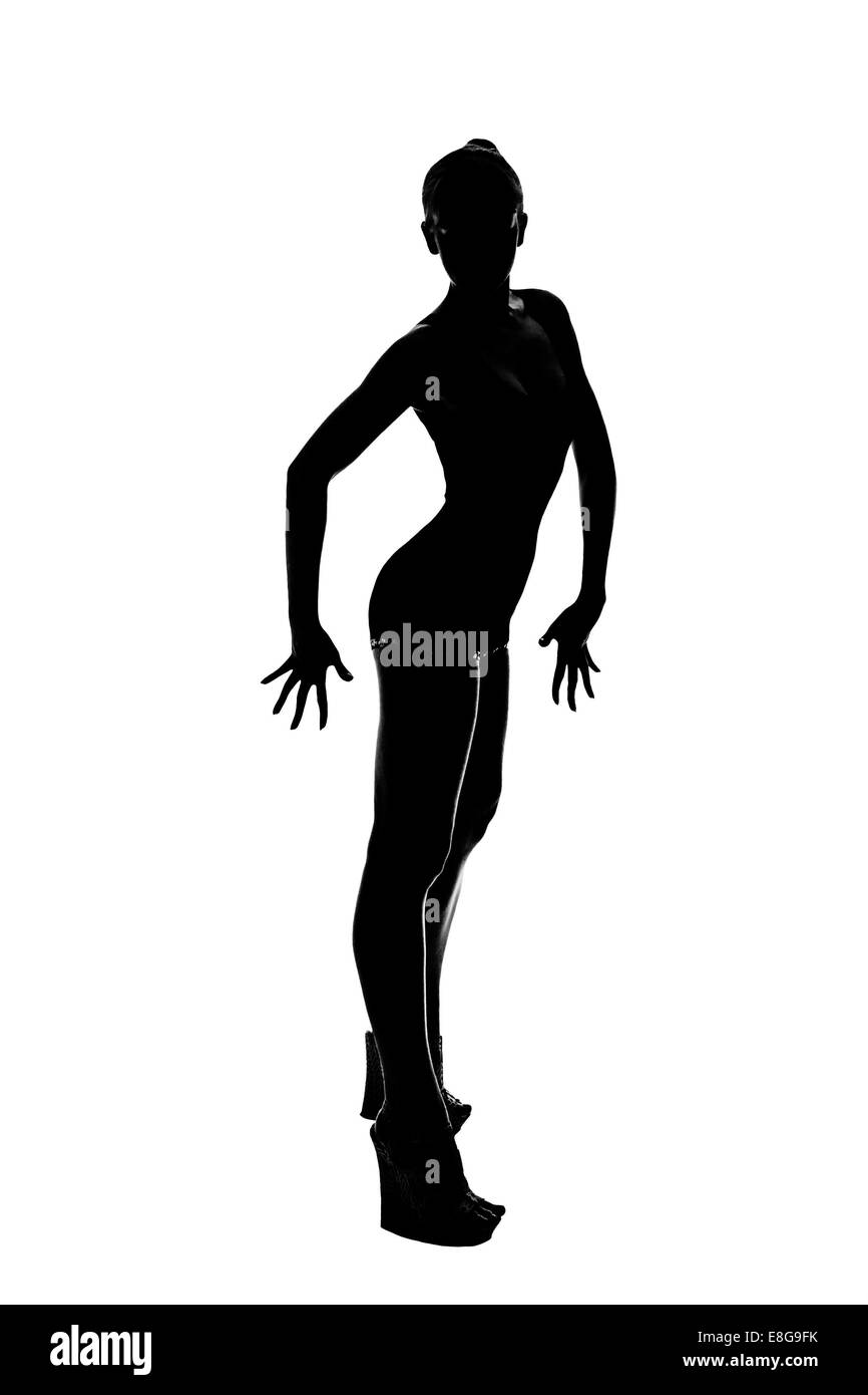 Slim silhouette ginnasta facendo esercizi isolati su sfondo bianco Foto Stock
