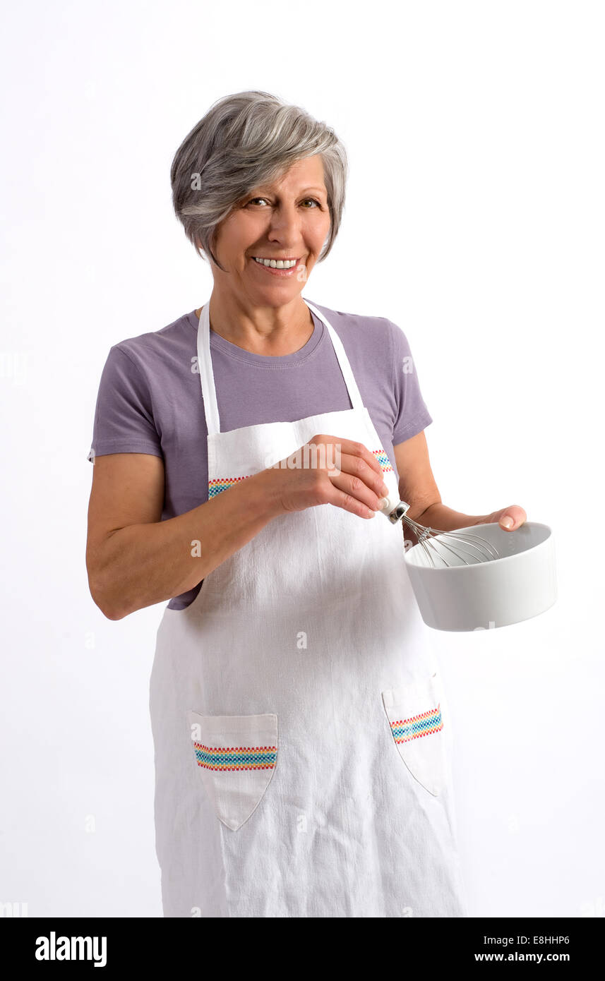 Donna anziana cook Foto Stock