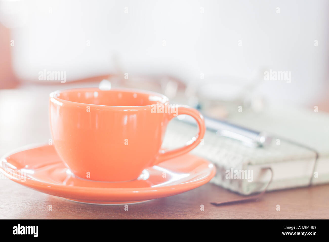 Mini orange tazza da caffè con i notebook, stock photo Foto Stock