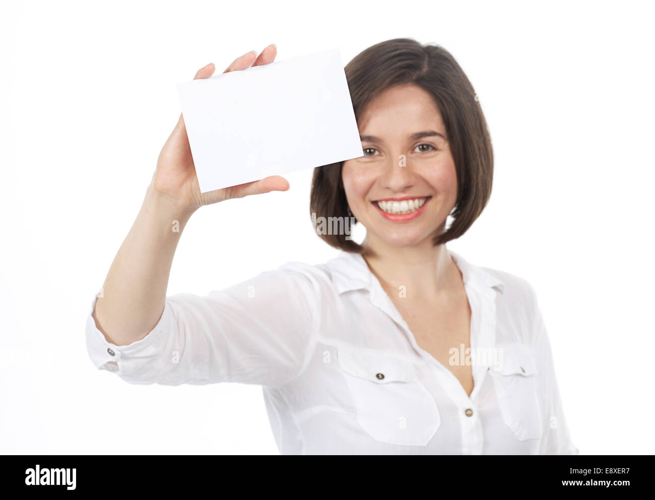 Bella bruna presentando un cartello bianco nel carattere del suo, isolato su bianco Foto Stock