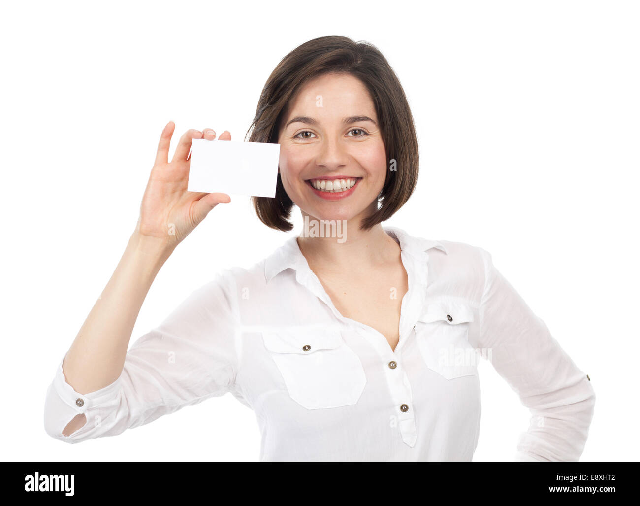 Piuttosto giovani brunette presentando un bianco business card, isolato su bianco Foto Stock