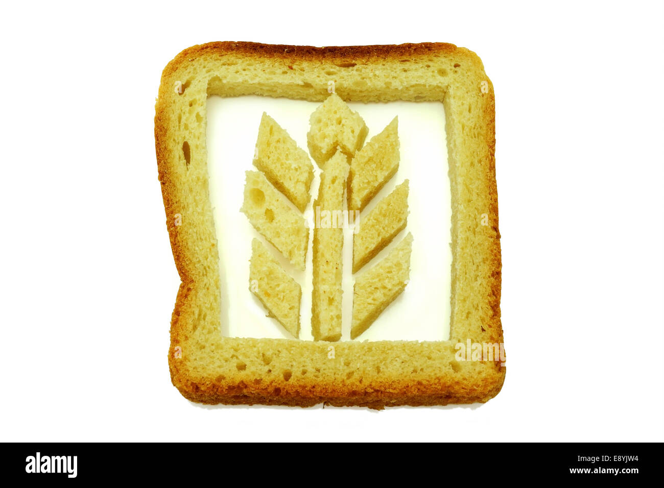 Il glutine. Foto simbolico con il grano dalla fetta di pane su sfondo bianco Foto Stock