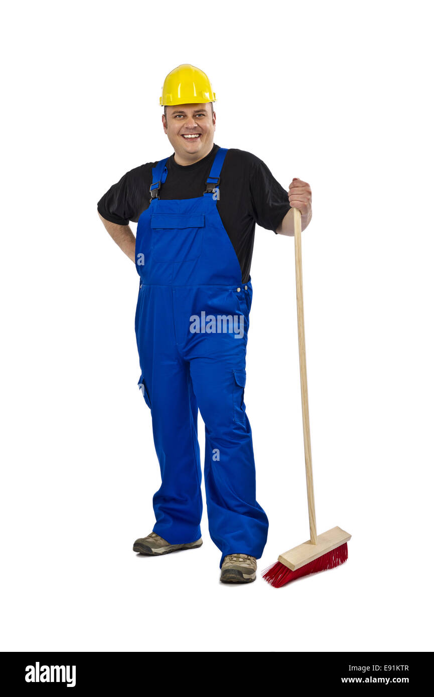 Lavoratore edile con una scopa Foto Stock