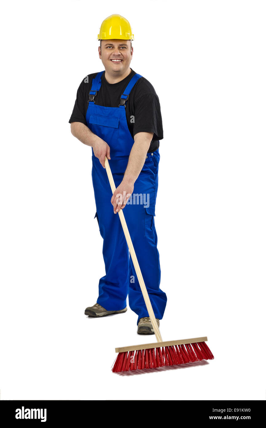 Lavoratore edile con una scopa Foto Stock