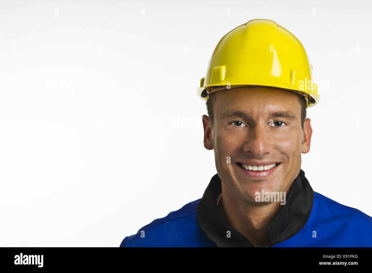 Lavoratore edile con dispositivi di protezione della testa Foto Stock