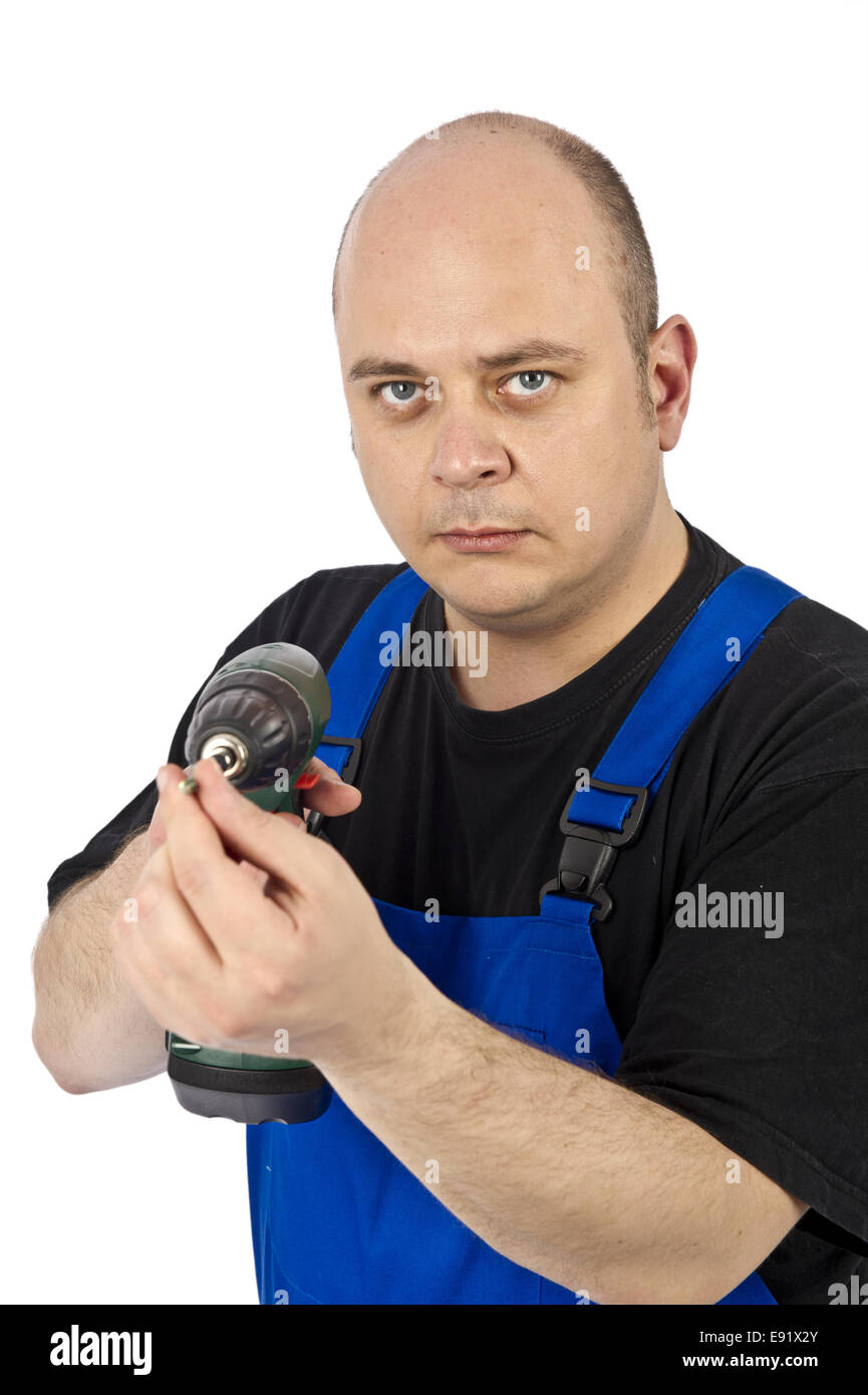 I tecnici utilizzando il cacciavite a batteria Foto Stock