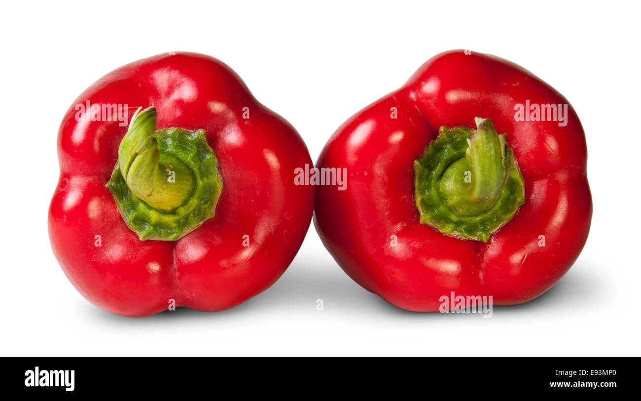 Due Peperoni rossi che giace accanto a isolati su sfondo bianco Foto Stock
