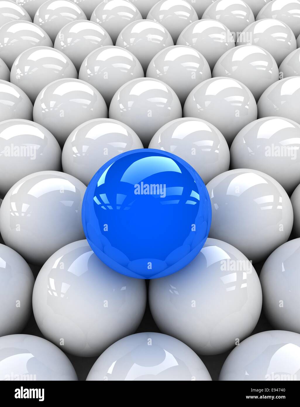 Una sfera blu observably collocato in un gruppo di sfere di bianco. Foto Stock