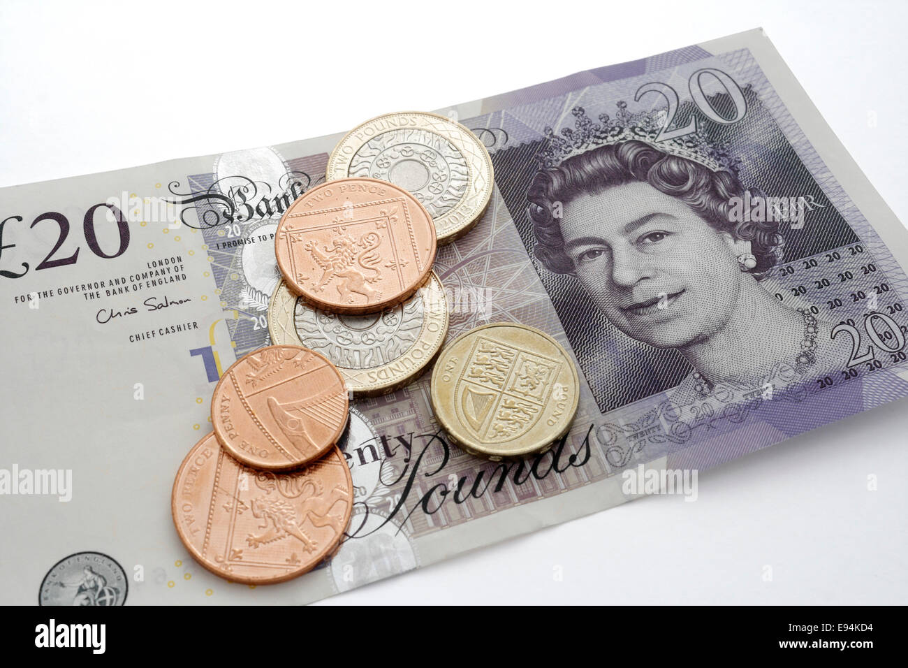 British £20 libbre nota con monete Foto Stock