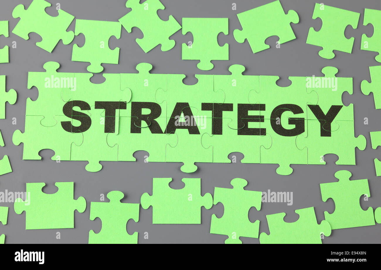 Jigsaw puzzle con la parola "strategia". Foto Stock