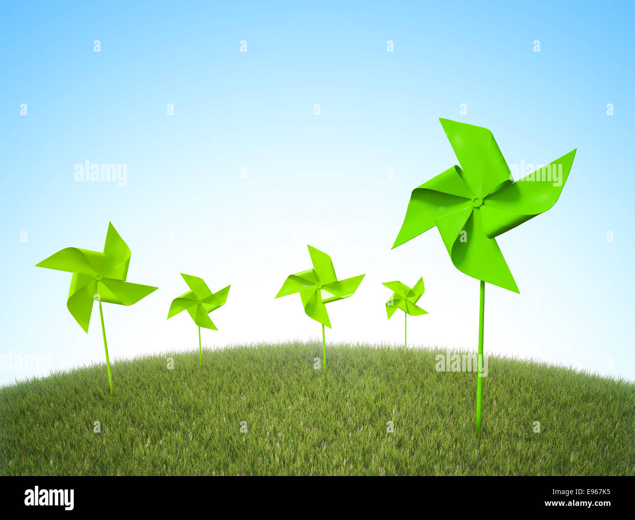 La girandola di mulini a vento in un campo di erba - Energie rinnovabili concetto Foto Stock