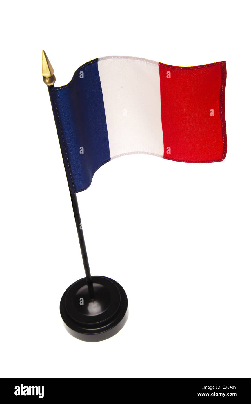 Piccola bandiera della Francia in un supporto isolato su uno sfondo bianco. Angolo di alta. Foto Stock