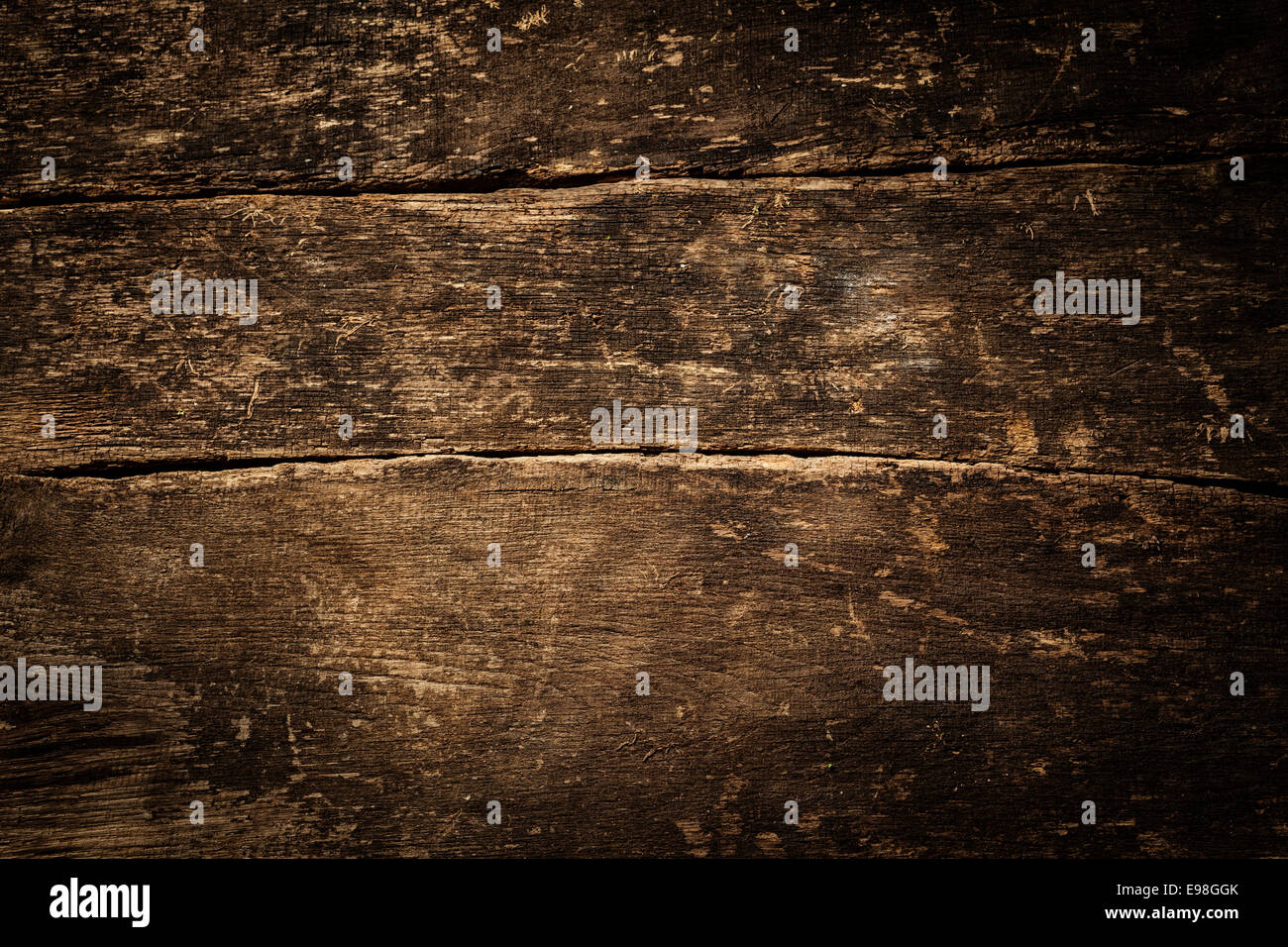 Texture di sfondo di rustici e vecchi weathered grunge incrinato il legno con un lato vignette Foto Stock