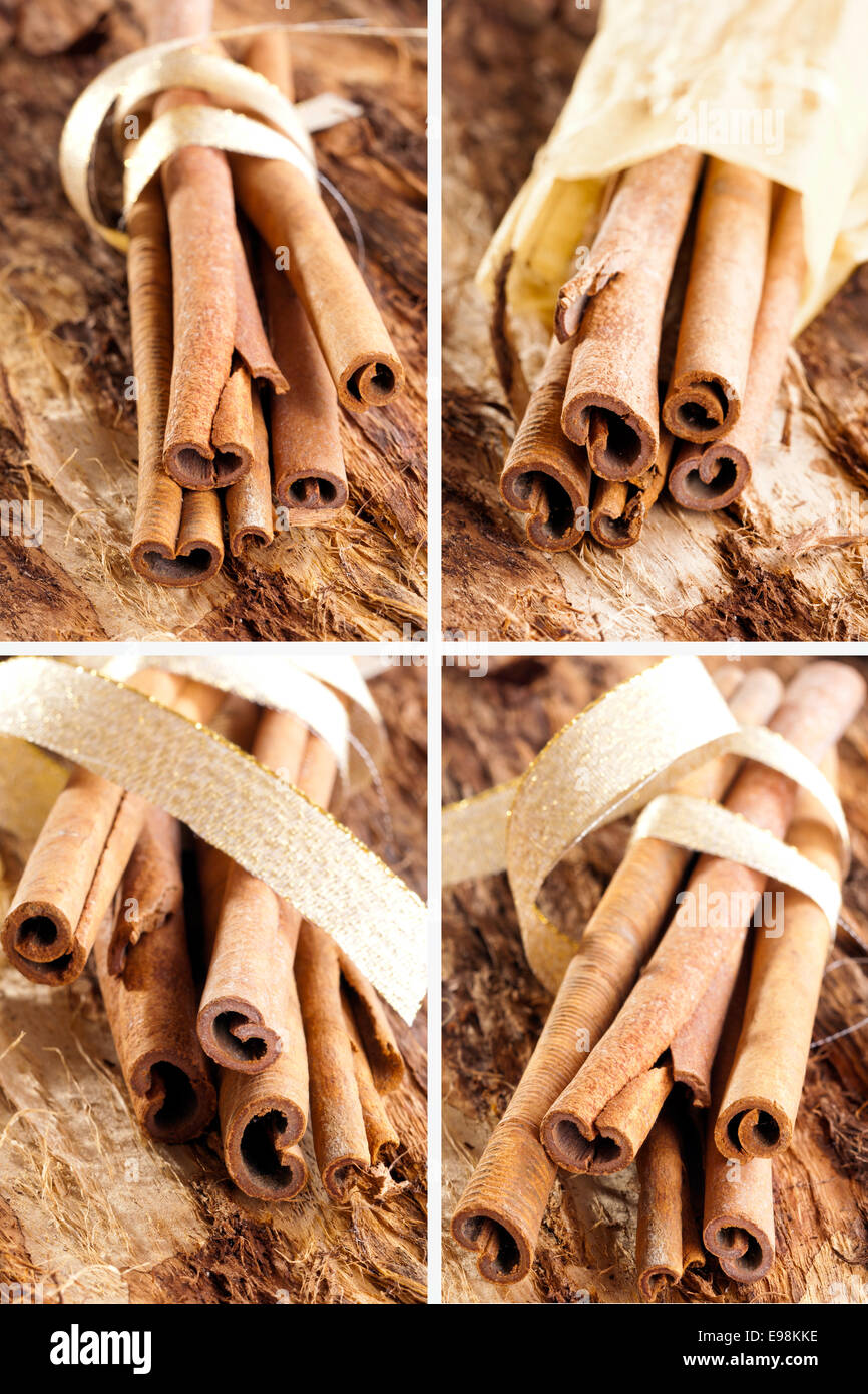 Mazzetto di bastoncini di cannella come un collage con un golden bow su un sfondo di legno. Foto Stock