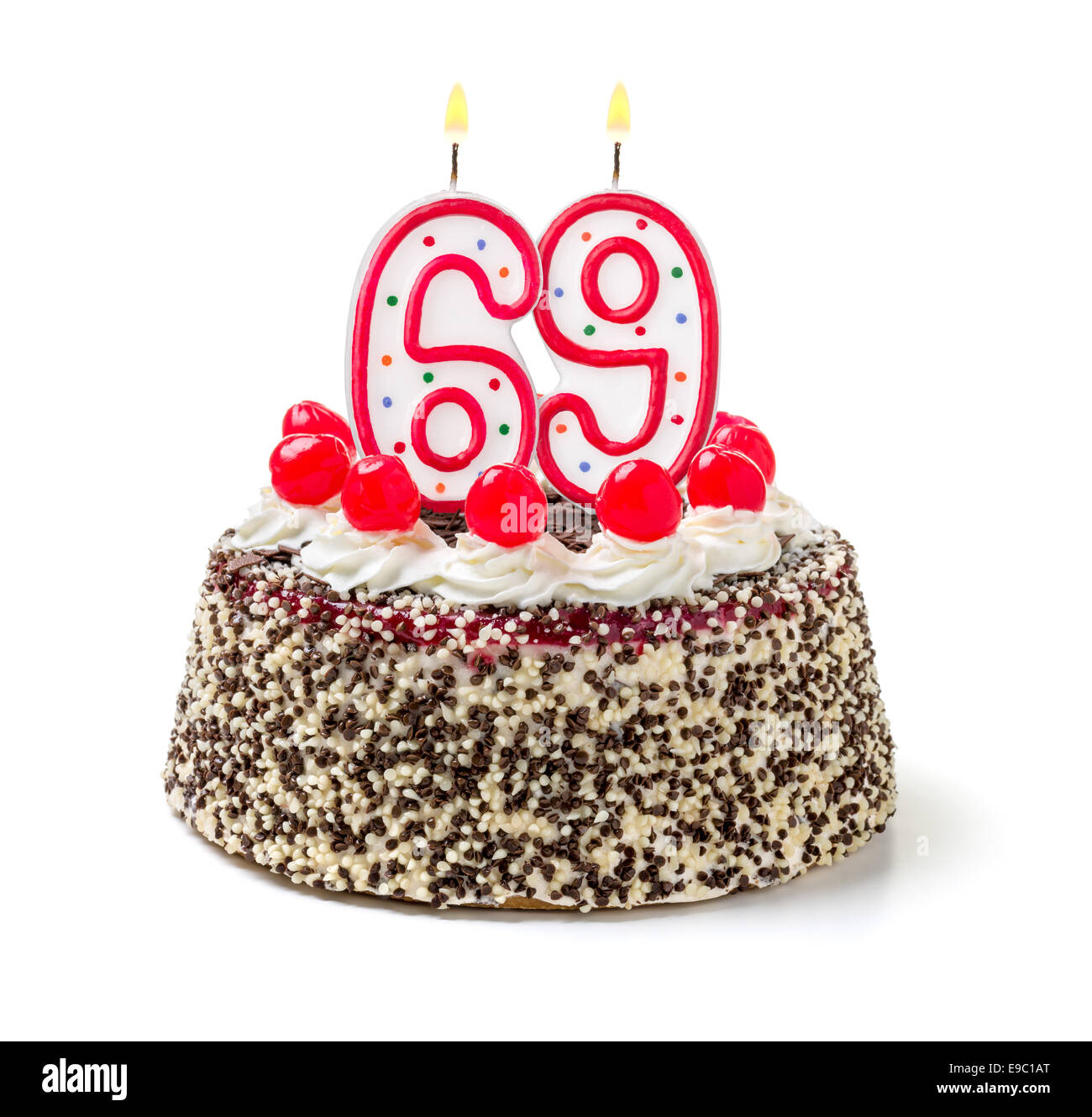 Torta di compleanno con candela che brucia numero 69 Foto Stock