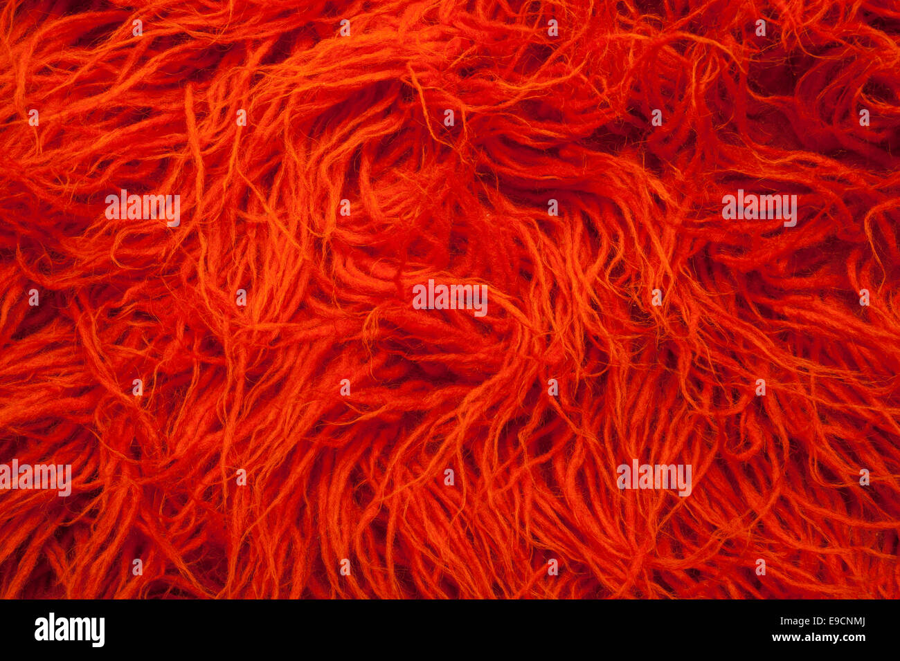 Orange tappeto di lana con capelli lunghi. Foto Stock