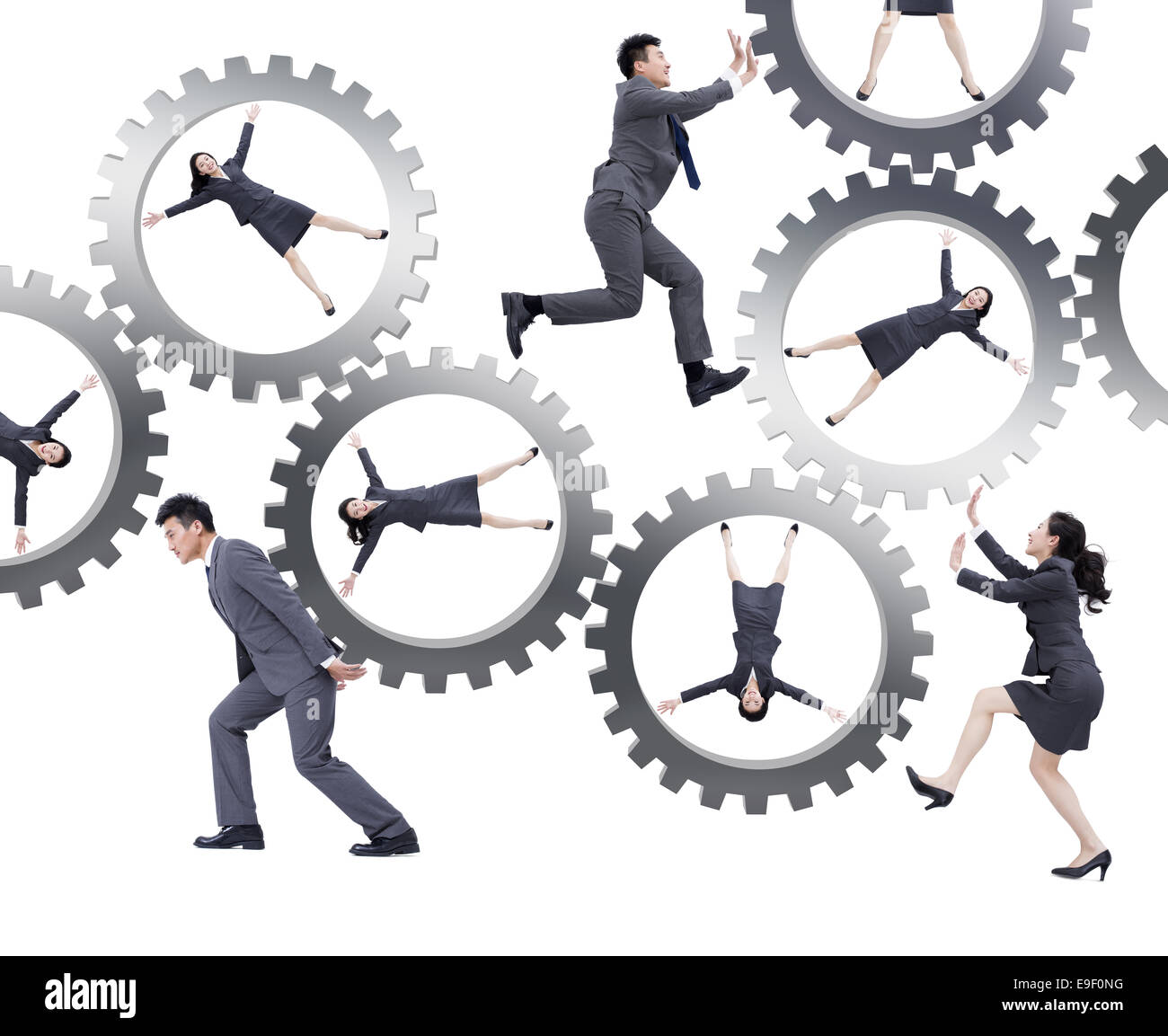 Young business persone ingranaggio di spinta Foto Stock