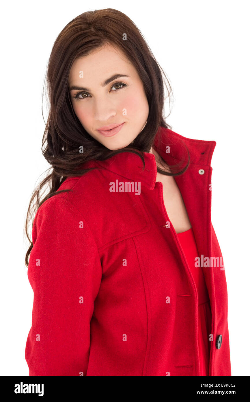 Ritratto di una bruna in rosso cappotto in posa Foto Stock