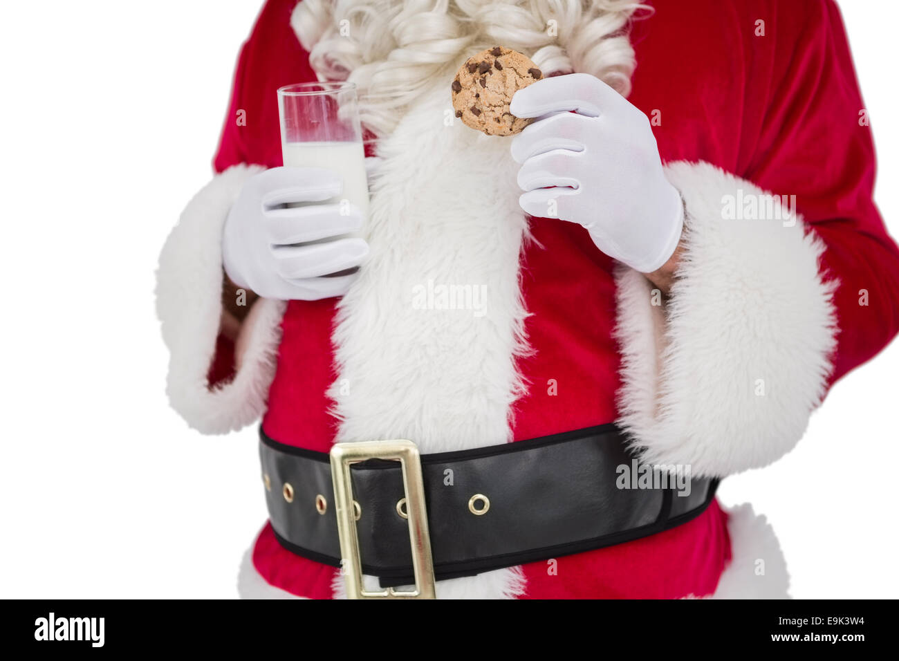 Santa holding cookie e il bicchiere di latte Foto Stock