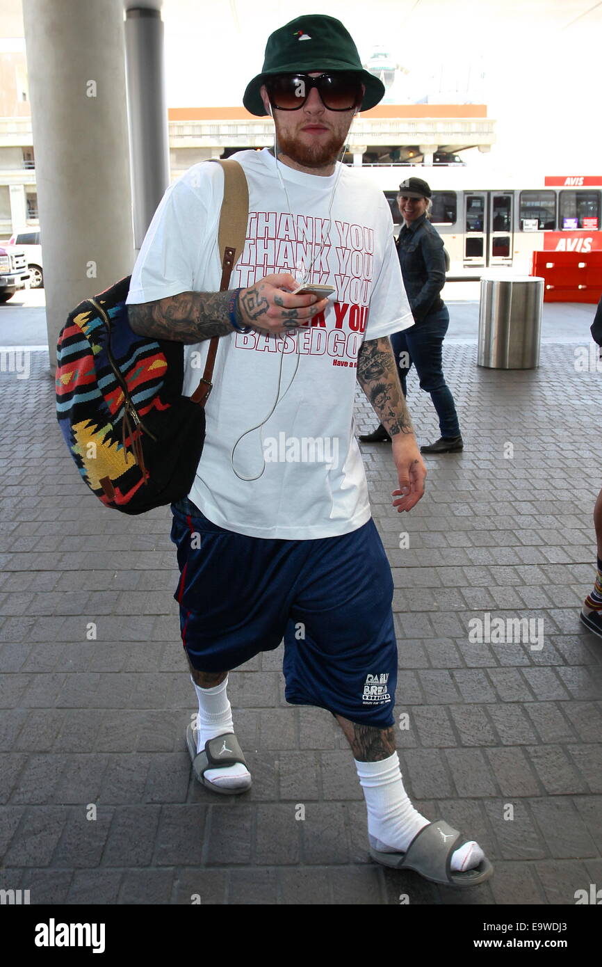Il rapper Mac Miller visto al di fuori del Tom Bradley International terminal presso l'aeroporto di Los Angeles. Dotato di: Mac Miller dove: Los Angeles, California, Stati Uniti quando: 30 Apr 2014 Foto Stock