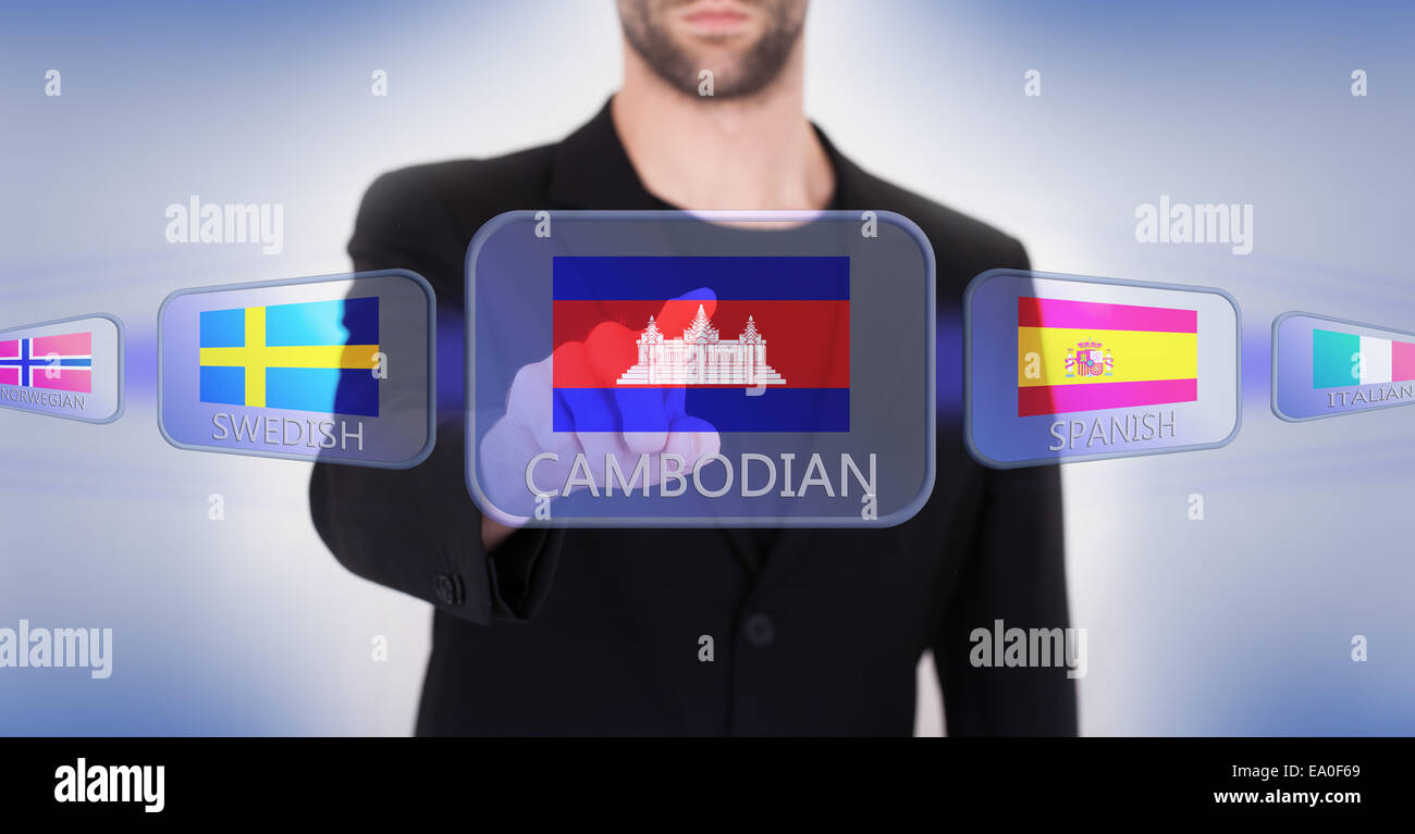 Mano che spinge su una interfaccia touch screen, scegliendo la lingua o il paese, Cambogia Foto Stock