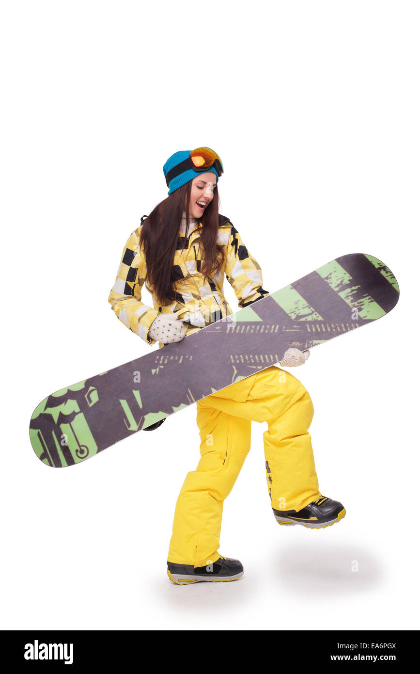 Giovane donna che simula la chitarra con lo snowboard Foto Stock