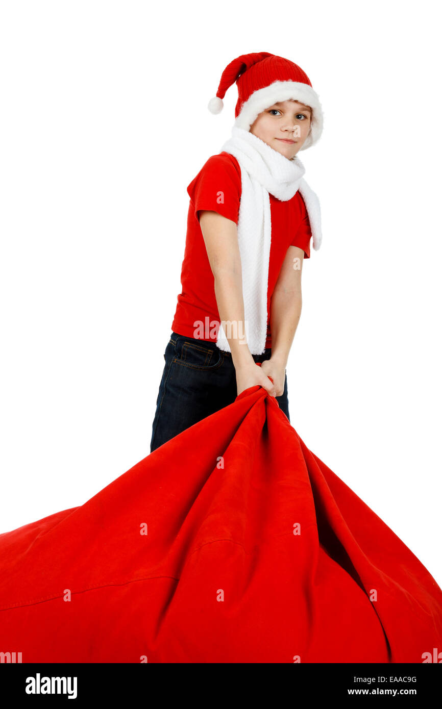 Ragazzo in Santa Claus hat con red borsa regalo di Natale su bianco Foto Stock