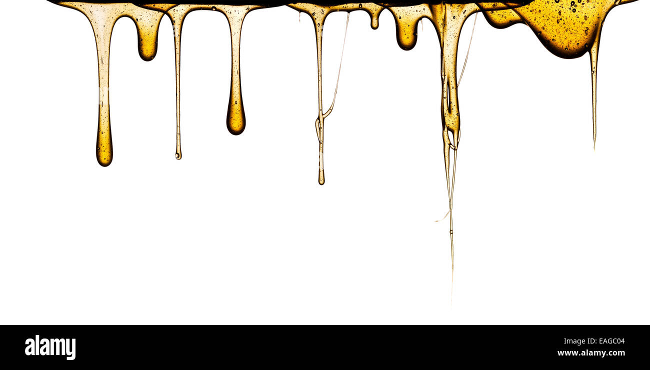 Il dolce miele gocciolamento isolati su sfondo bianco Foto Stock