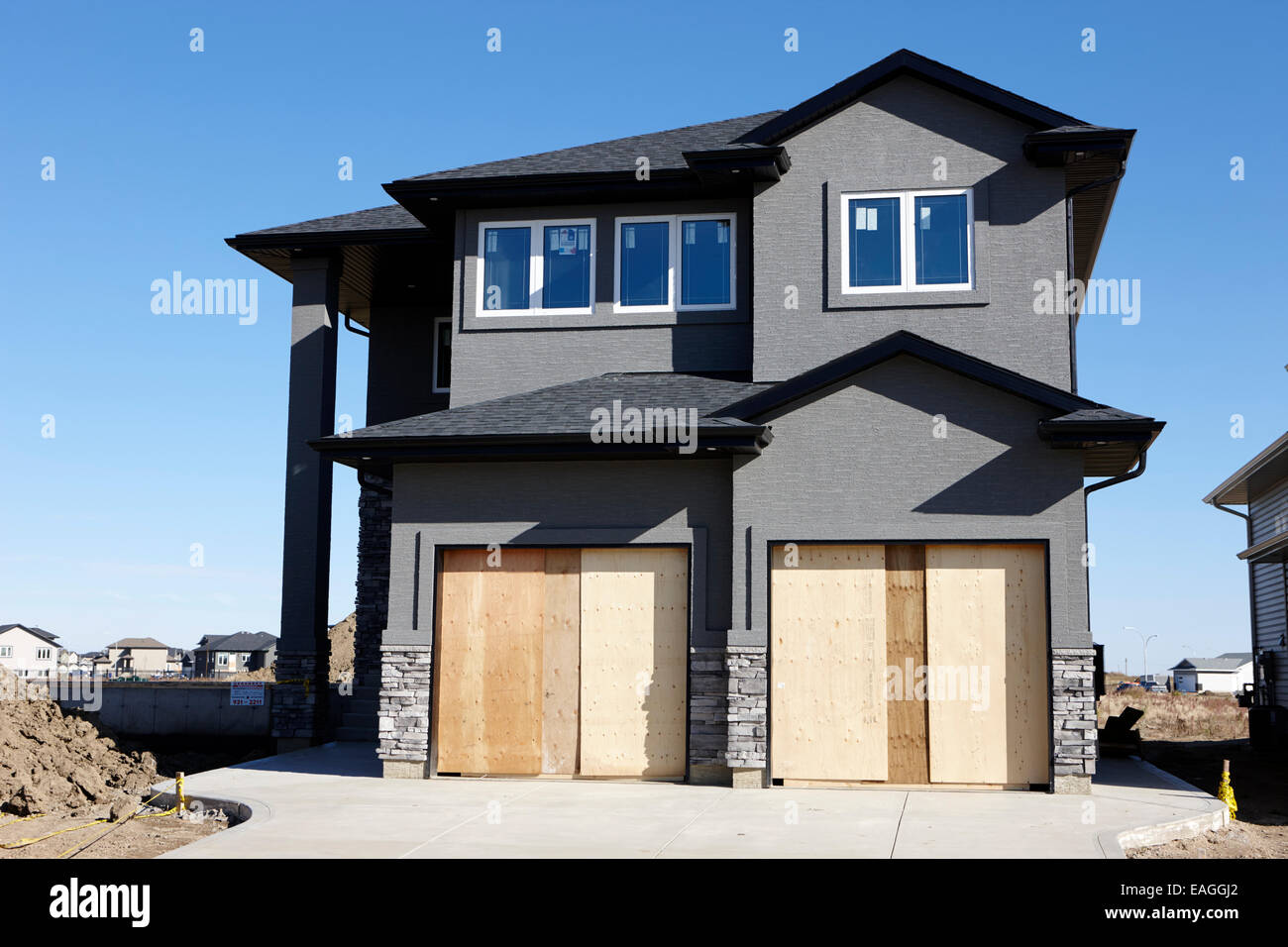 Sviluppo di nuovi legni suburbana incorniciato home saskatoon Saskatchewan Canada Foto Stock