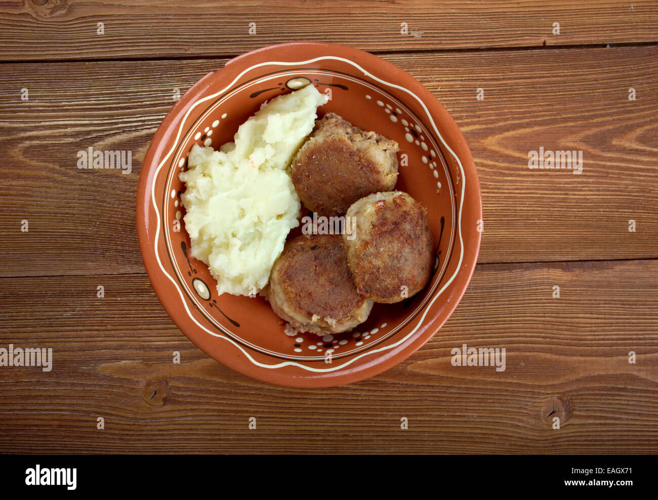 Scotch Collops.Scottish piatto nazionale di carni bovine, aringa e cipolle Foto Stock