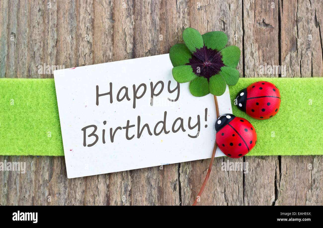 Inglese biglietto di auguri di compleanno con Leafed trifoglio e ladybugs Foto Stock