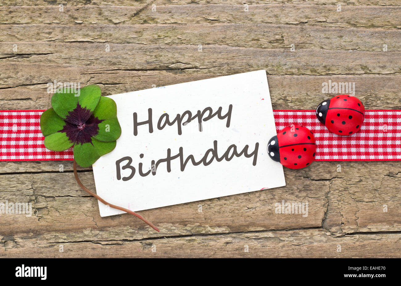 Inglese biglietto di auguri di compleanno con Leafed trifoglio e ladybugs Foto Stock