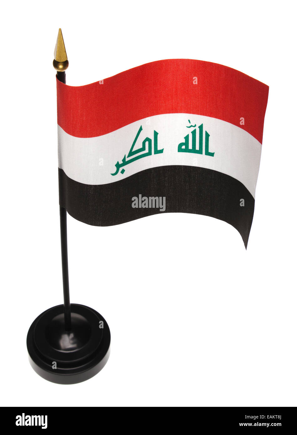 Piccola bandiera dell'Iraq in un supporto isolato su uno sfondo bianco. Angolo di alta. Foto Stock