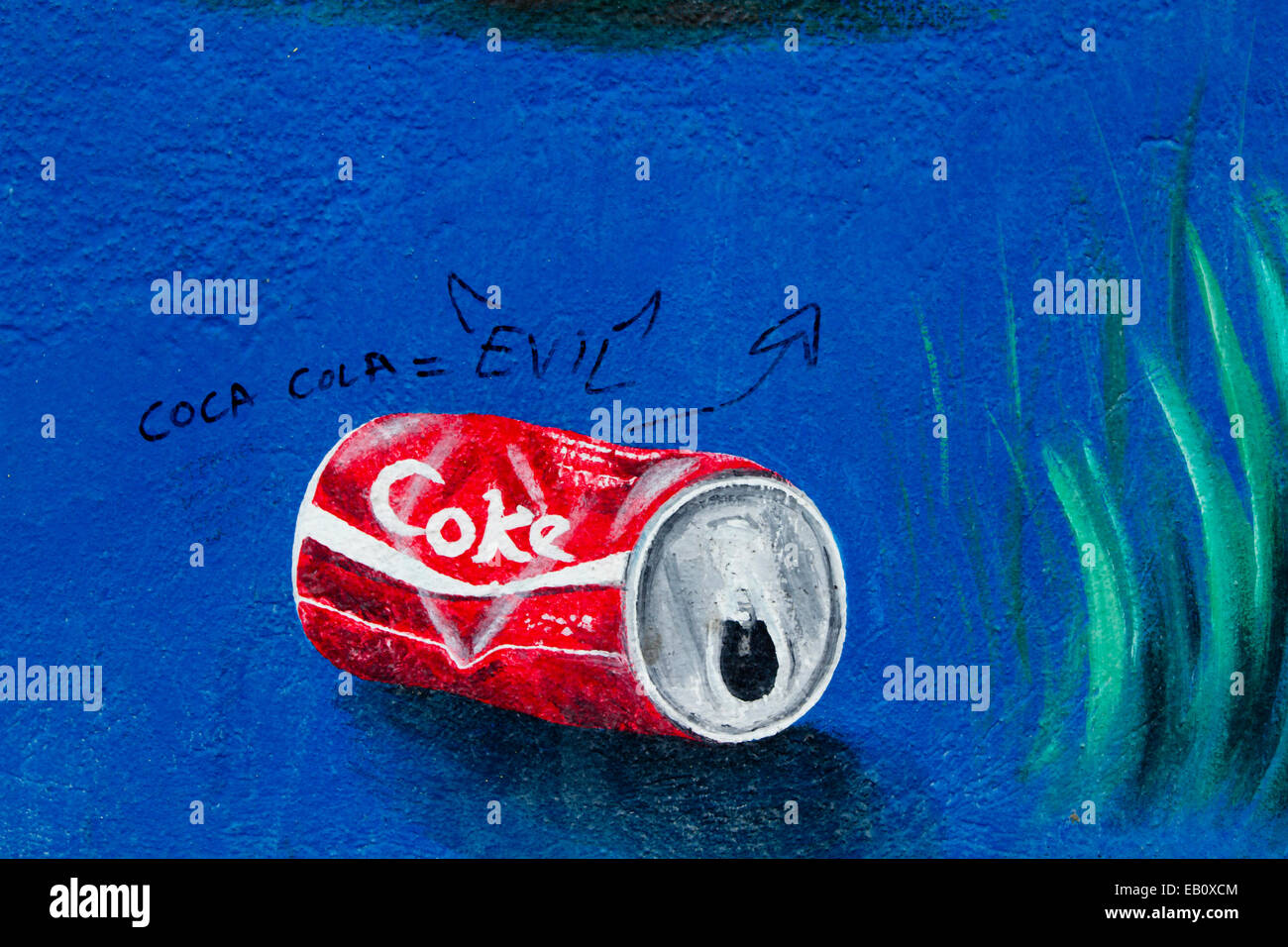 Berlin Wall Street Art Graffiti coca cola male Foto Stock