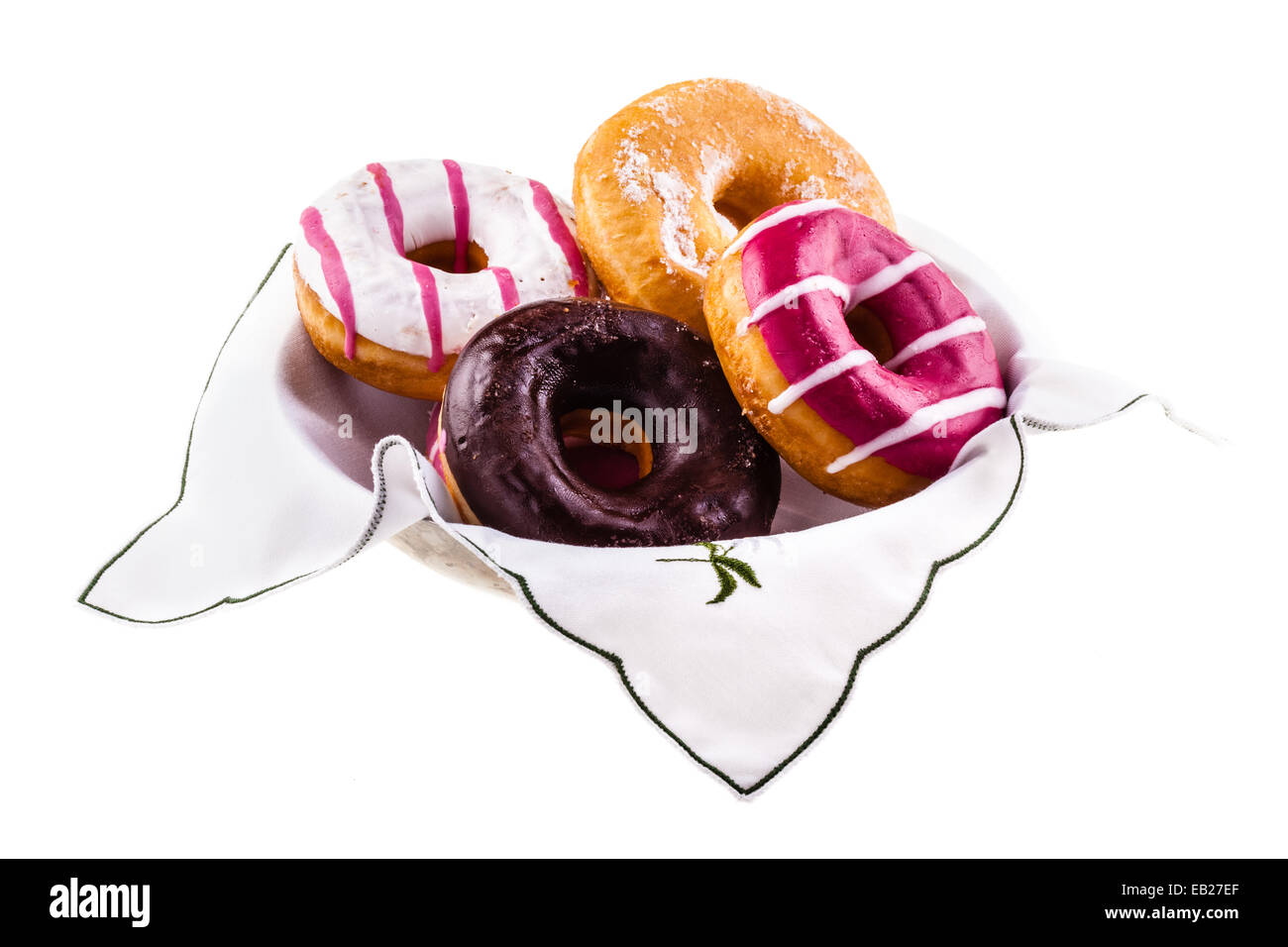 Una collezione di deliziosi e ciambelle colorate su una piastra Foto Stock