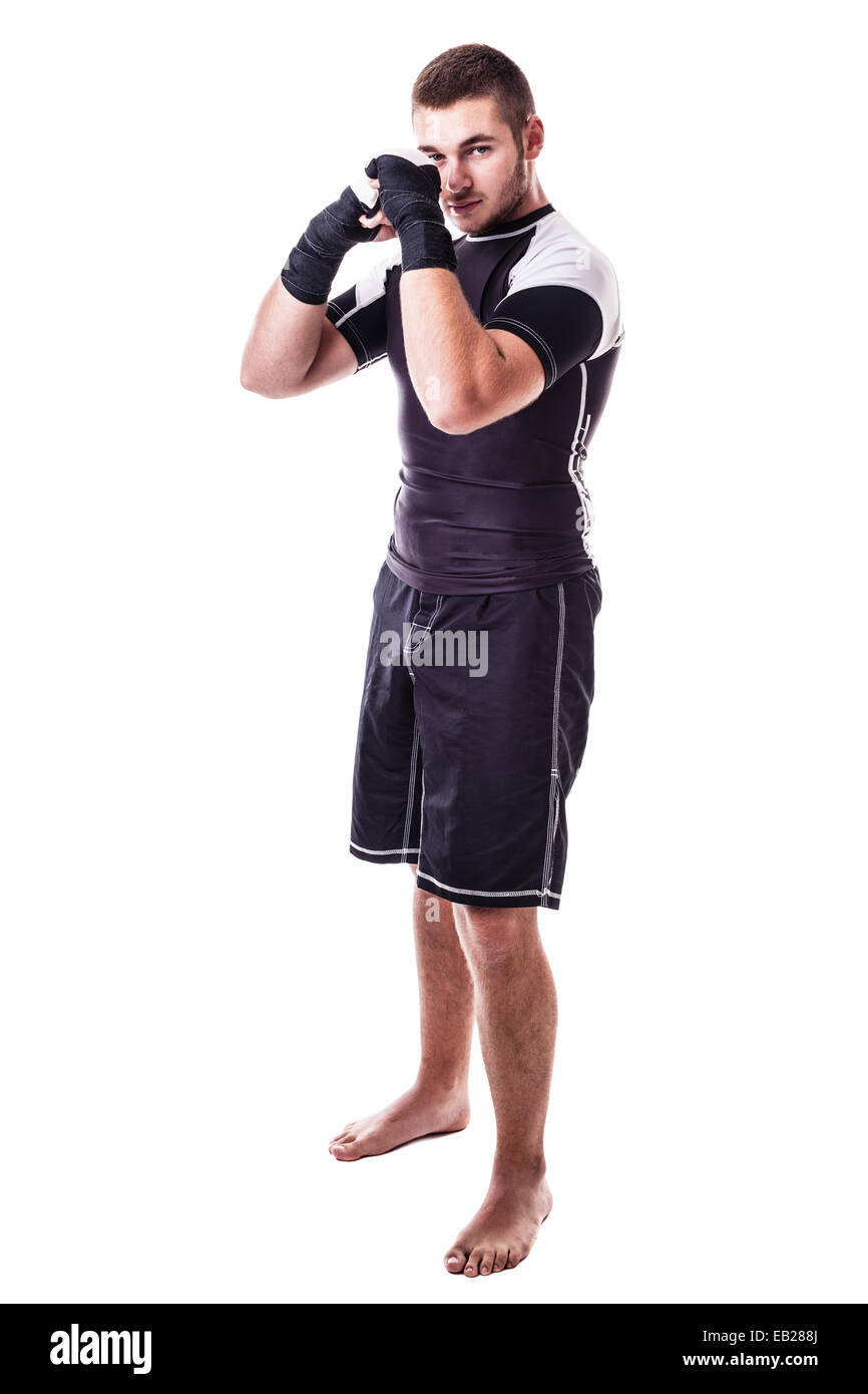 Un giovane kickboxer o boxer isolate su uno sfondo bianco Foto Stock