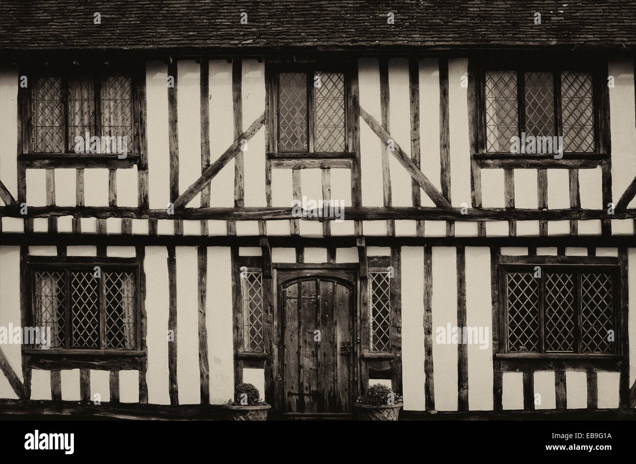 Inglese a struttura mista in legno e muratura in bianco e nero in stile Tudor case da Lavenham, Suffolk in Inghilterra. Antiche foto in bianco e nero. Foto Stock