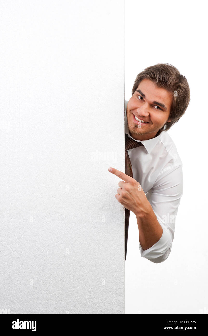 Imprenditore puntando verso un pannello bianco, Germania Foto Stock