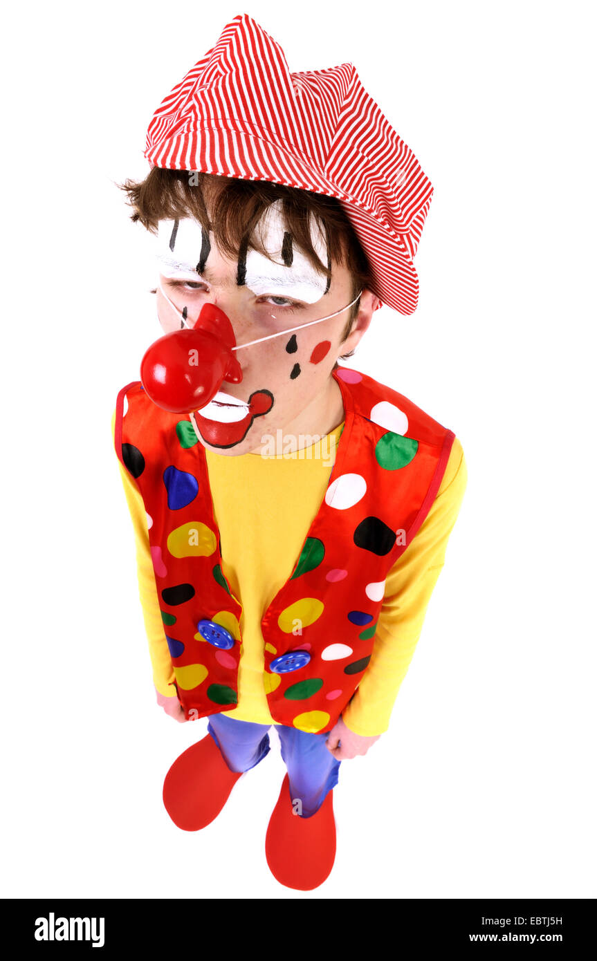 Drunken ragazzo adolescente vestito come un clown Foto Stock