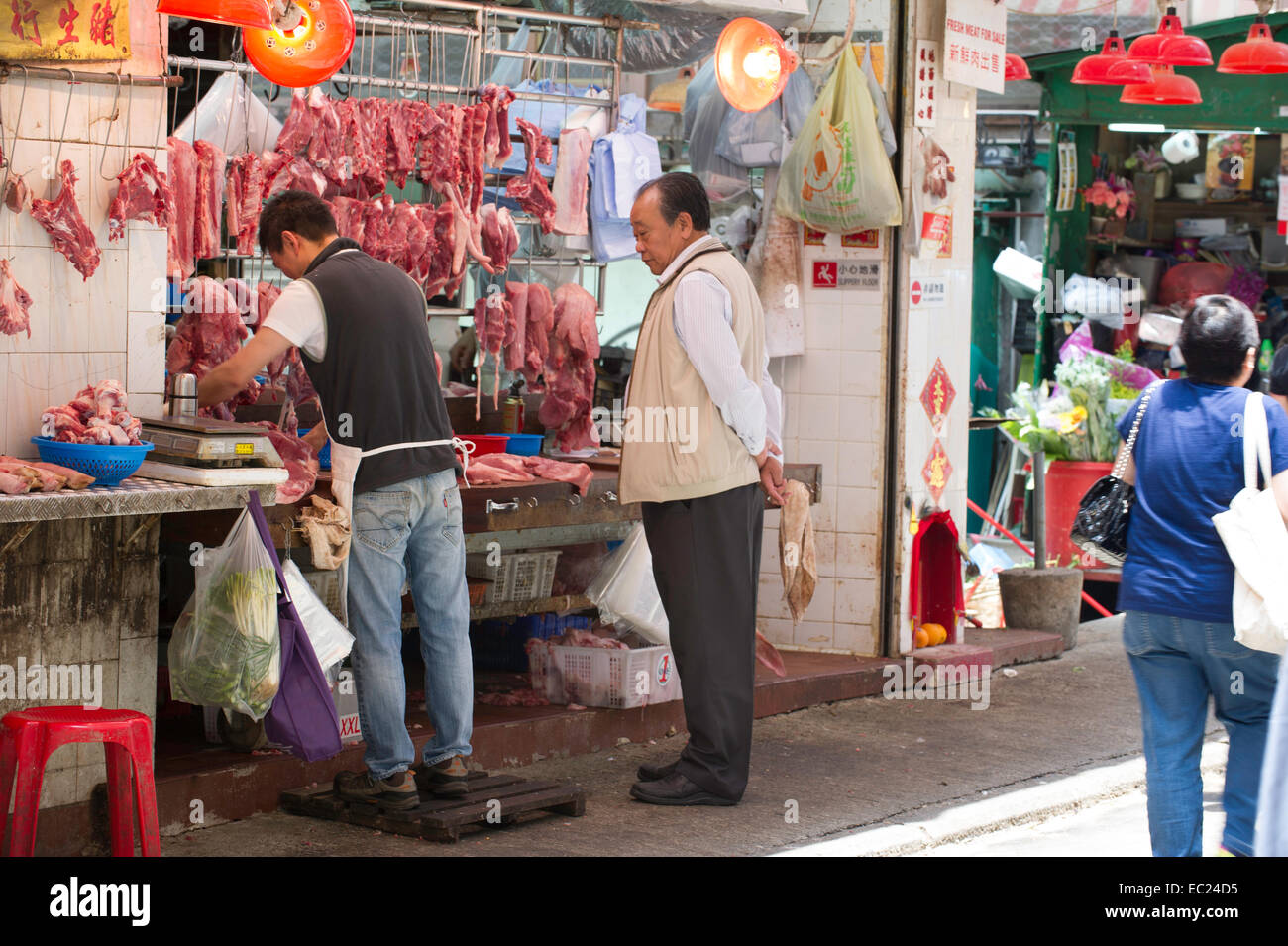 Hong Kong street market butcher Foto Stock
