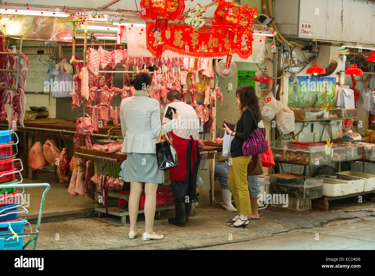 Hong Kong street market butcher Foto Stock