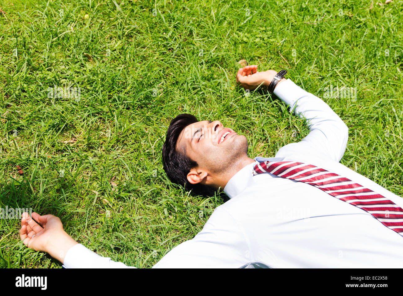 Indian business man park Relax Foto Stock