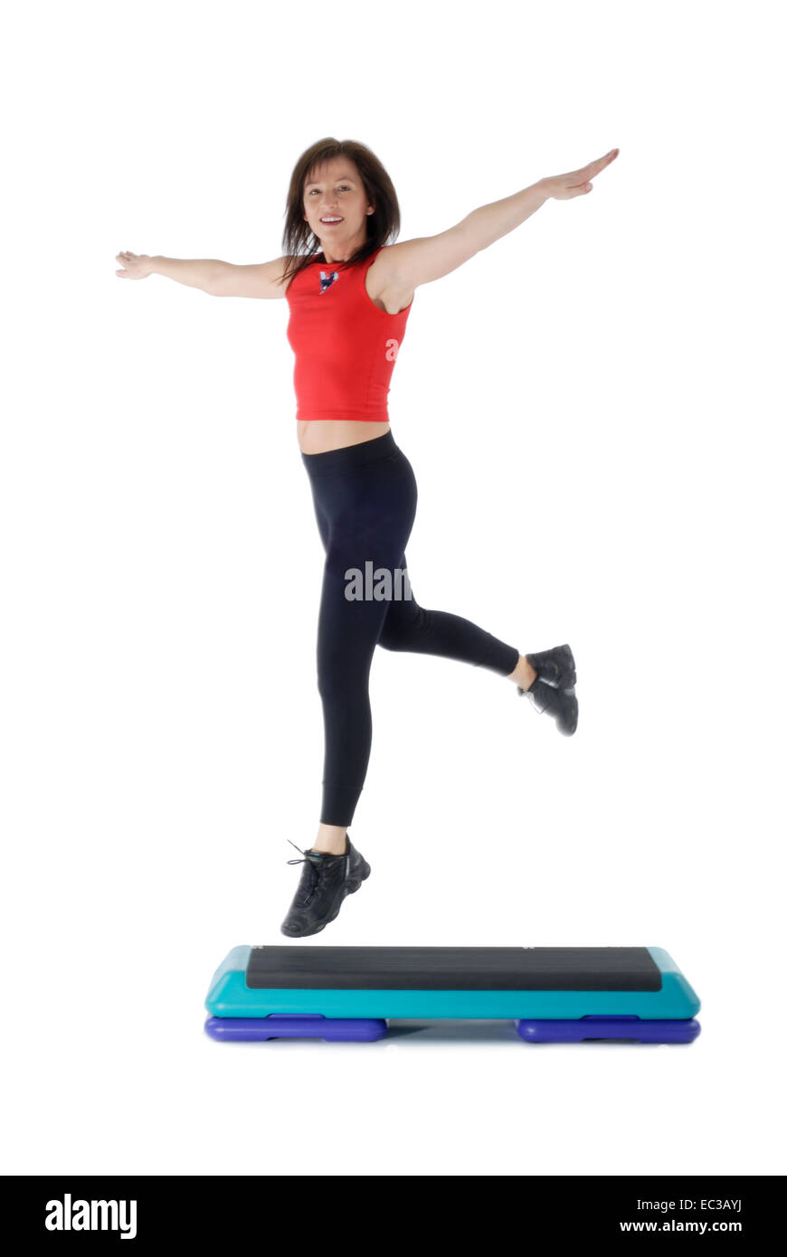 Donna al Stepper aerobica Foto Stock