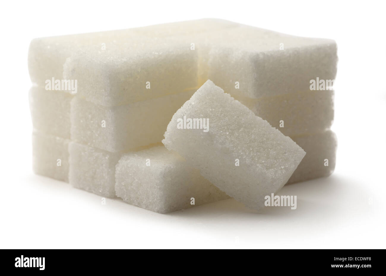 Zollette di zucchero su sfondo bianco Foto Stock