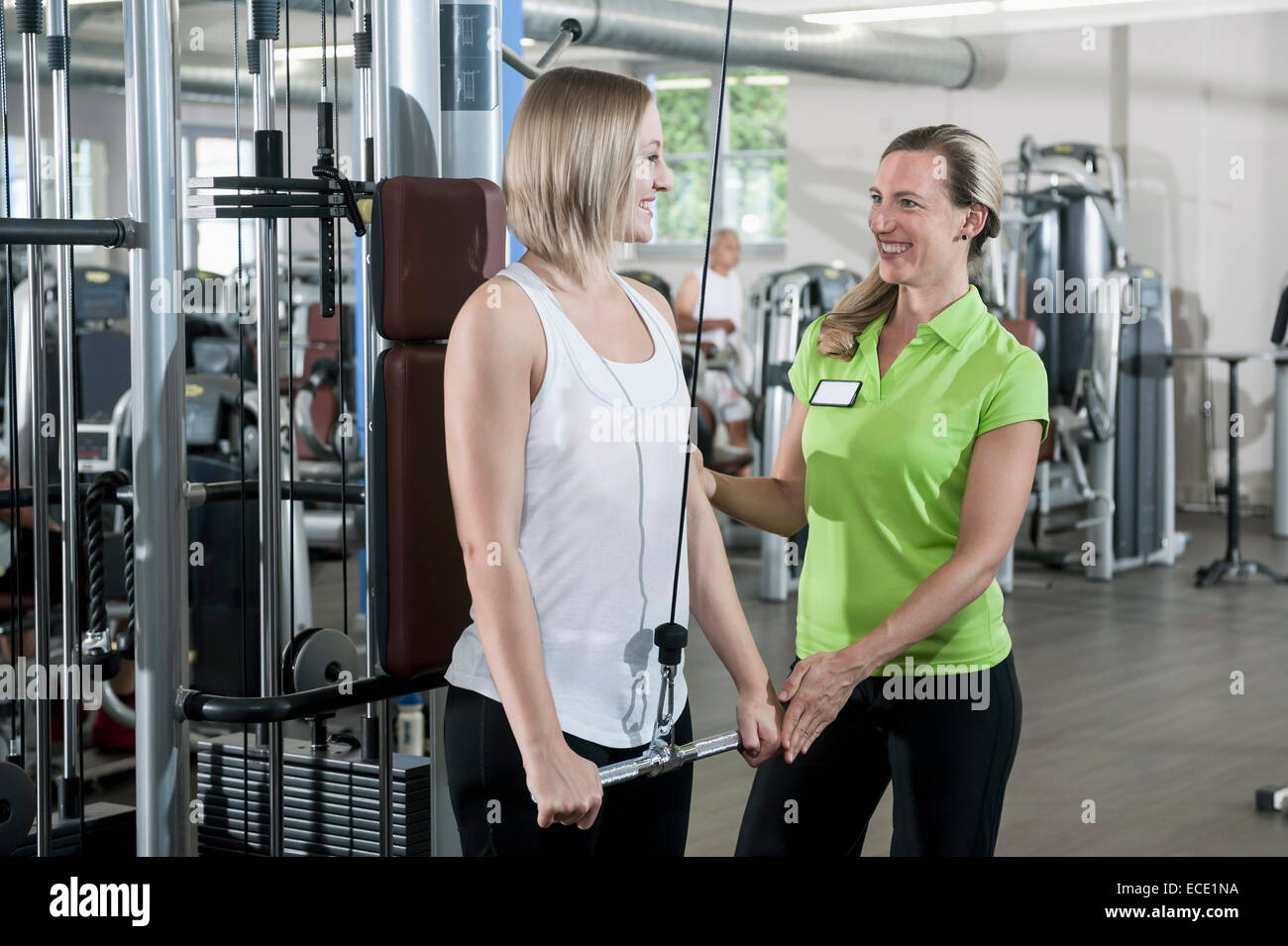 Donna studio fitness trainer sport assistenza Foto Stock