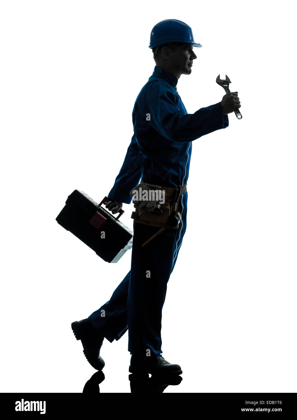 Un aggiustatore lavoratore silhouette in studio su sfondo bianco Foto Stock