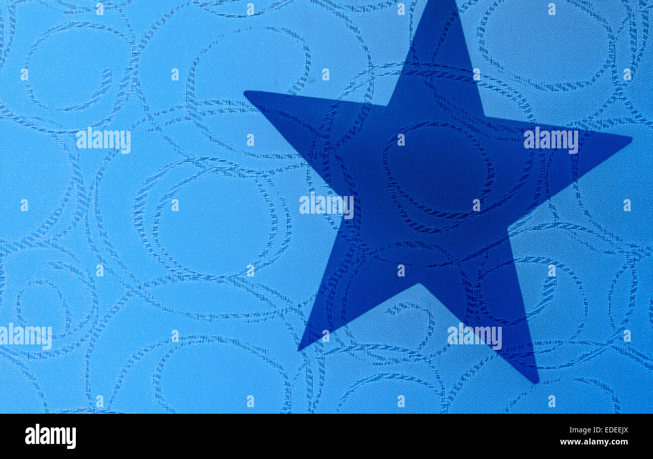Ombra di una stella a cinque punte su un tessuto modellato. Foto Stock