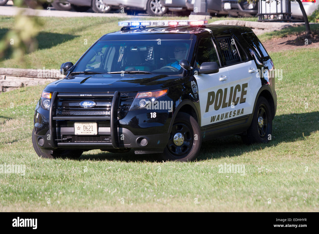 Città di Waukesha funzionario di polizia in una squadra di un SUV Foto Stock