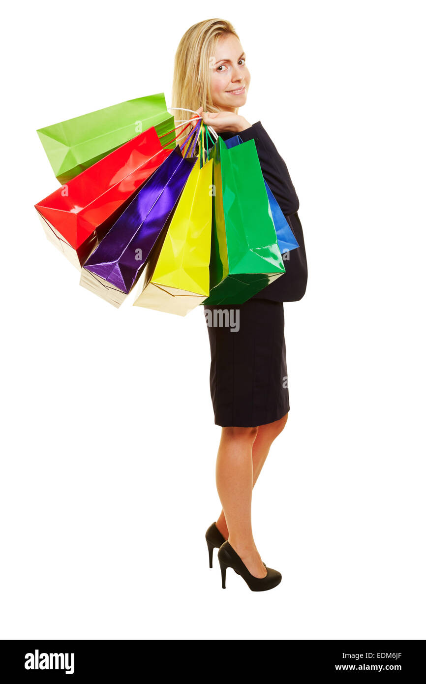 Imprenditrice sorridente con molte borse per lo shopping isolato su bianco Foto Stock