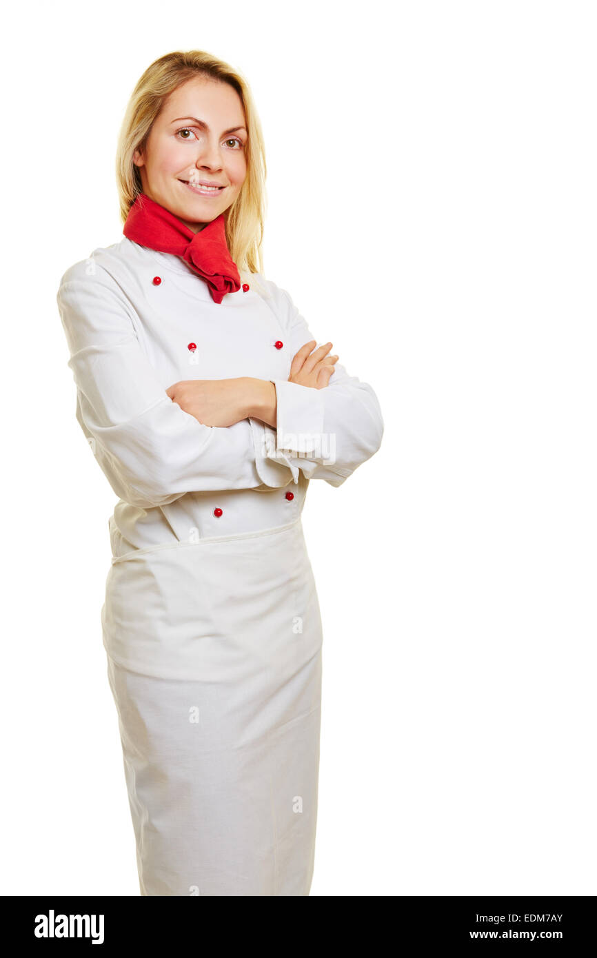 Giovane donna sorridente come chef di cucina in bianco workwear Foto Stock